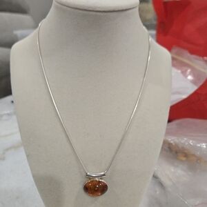 Elegant Silver Necklace with Amber Pendant